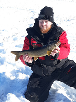 Man holding Lake Trout he caught.