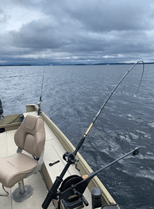 Six Fins Guide Service open water fishing boat with fishing rods in place.